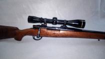 Custom sporterized Mauser with a hand-shaped walnut stock