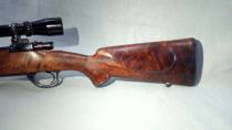 Custom sporterized Mauser with a hand-shaped walnut stock
